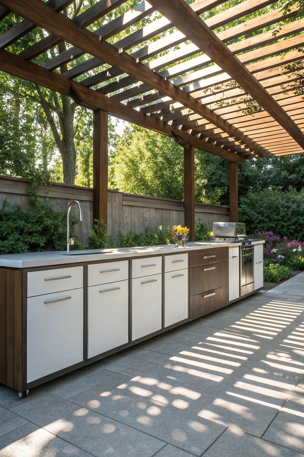 Enhance your outdoor kitchen with cabinets nestled under a charming pergola.