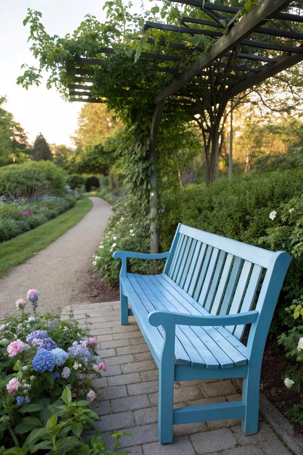 A blue ombre bench that beautifully transitions through shades of sky blue.