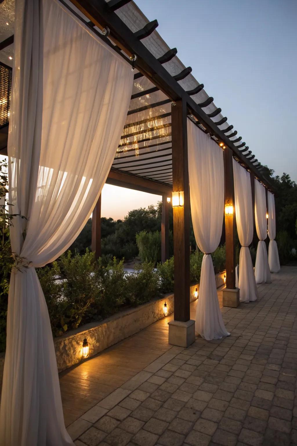Fabric curtains creating a romantic and cozy pergola space