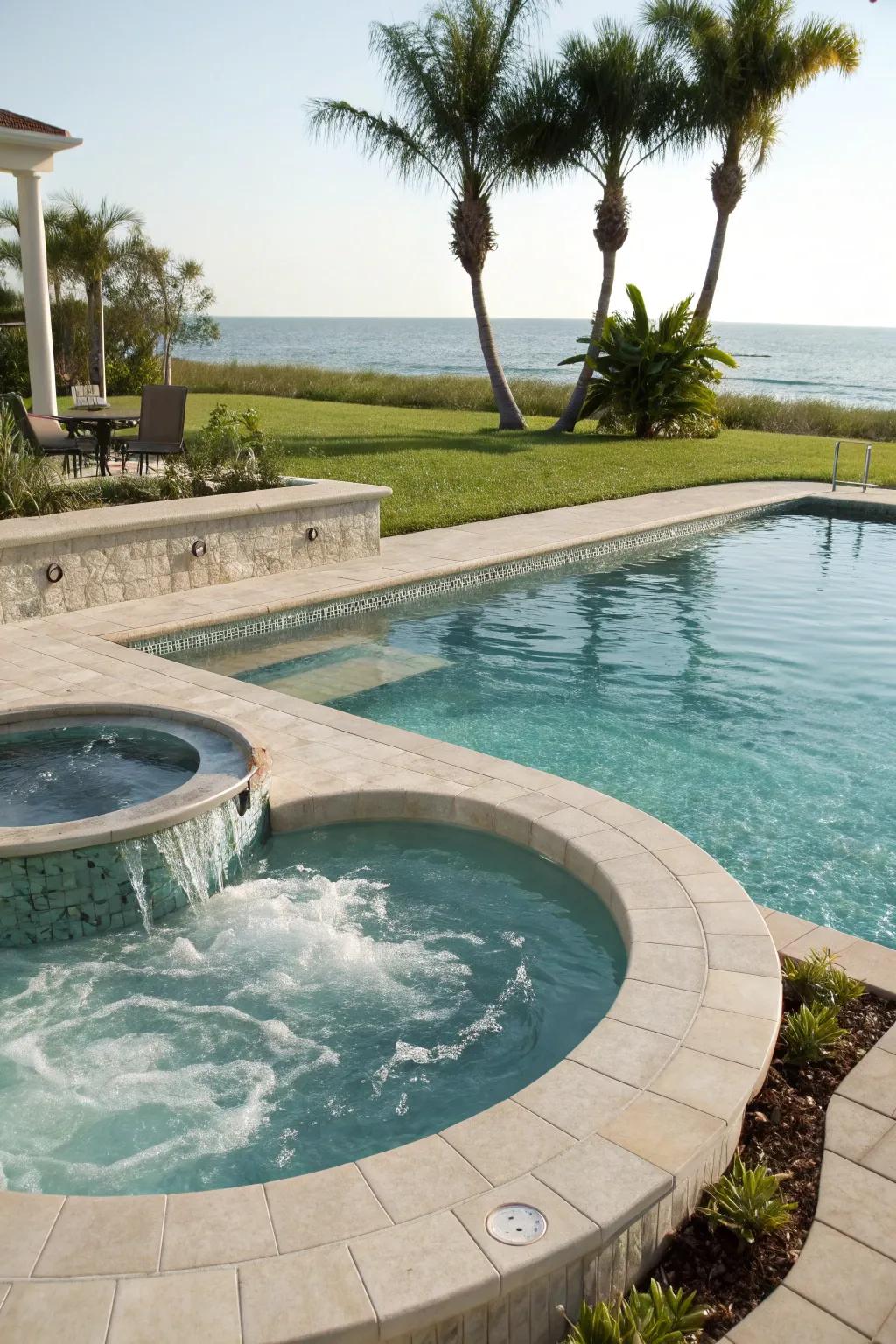 A luxurious pool area featuring a seamlessly integrated hot tub.
