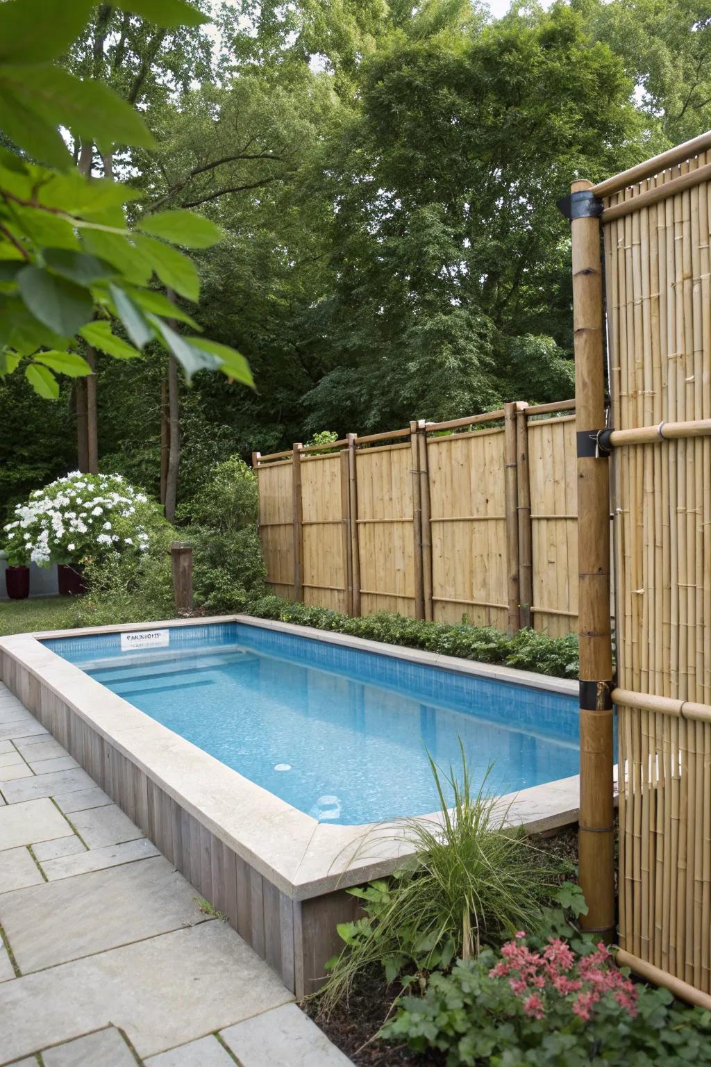 An intimate pool setting enhanced with bamboo privacy screens.