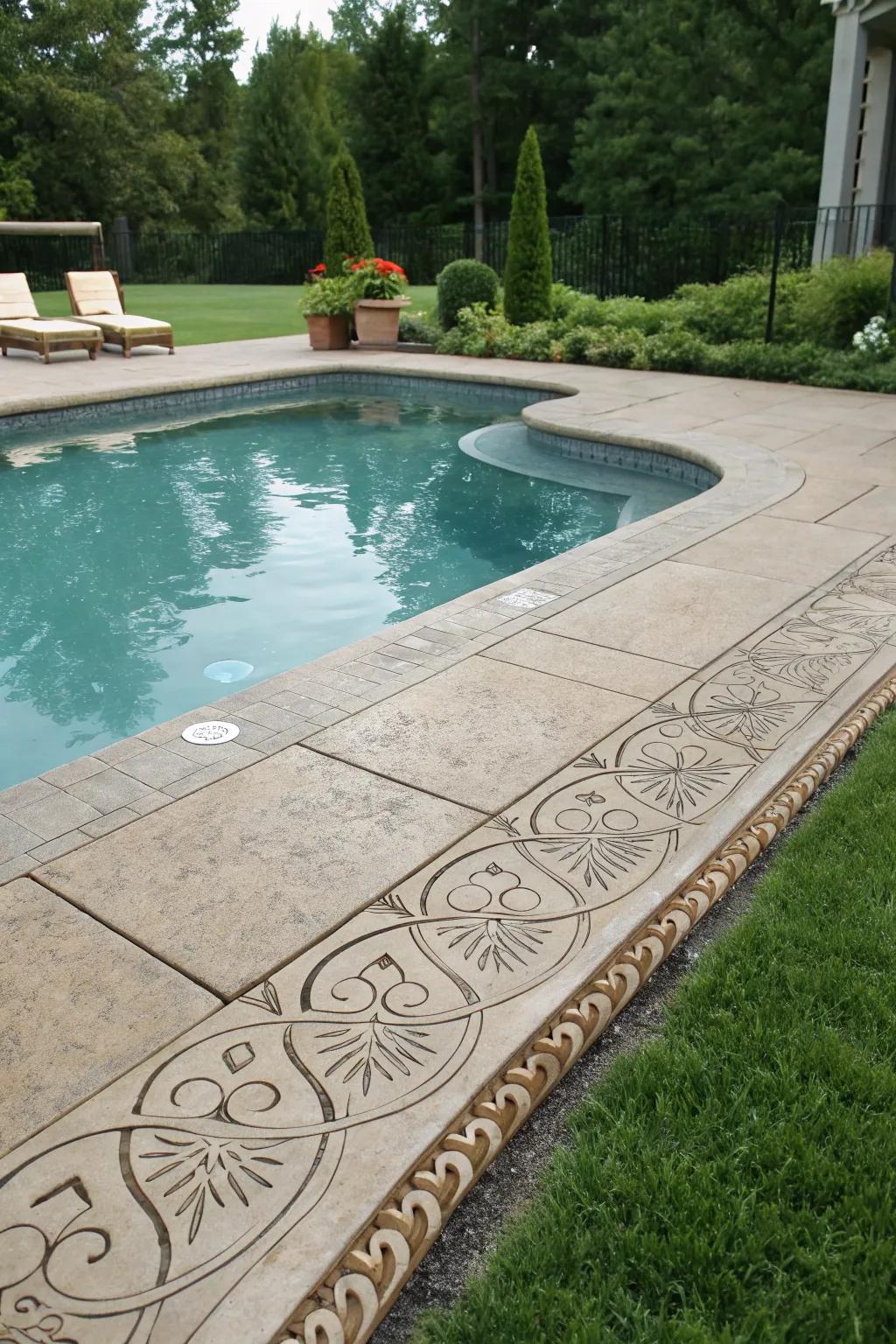 Elegantly framed pool with decorative stamped concrete borders.