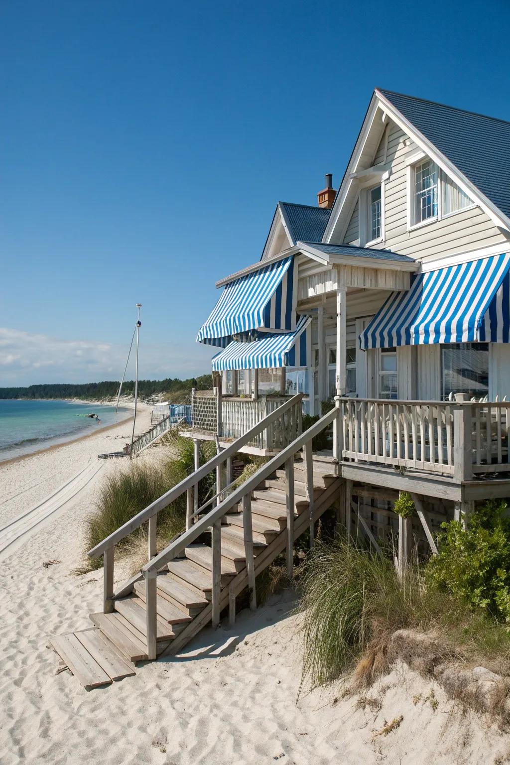 Striped awnings add a playful touch to this beach house.