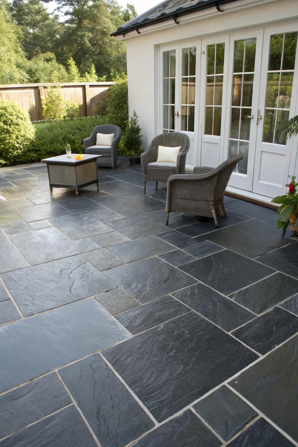 Sleek slate tiles give this patio a modern, easy-to-maintain surface.