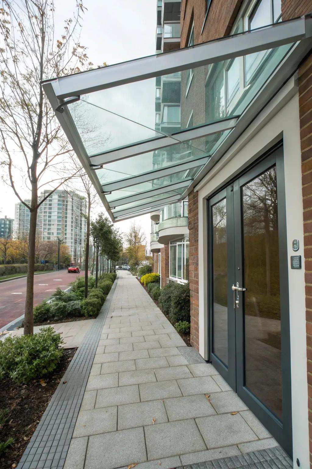 A glass canopy offers a modern, airy feel to this entrance.