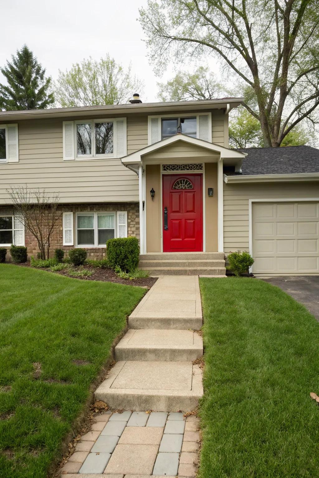 A bold red front door adds character to this home's entryway.