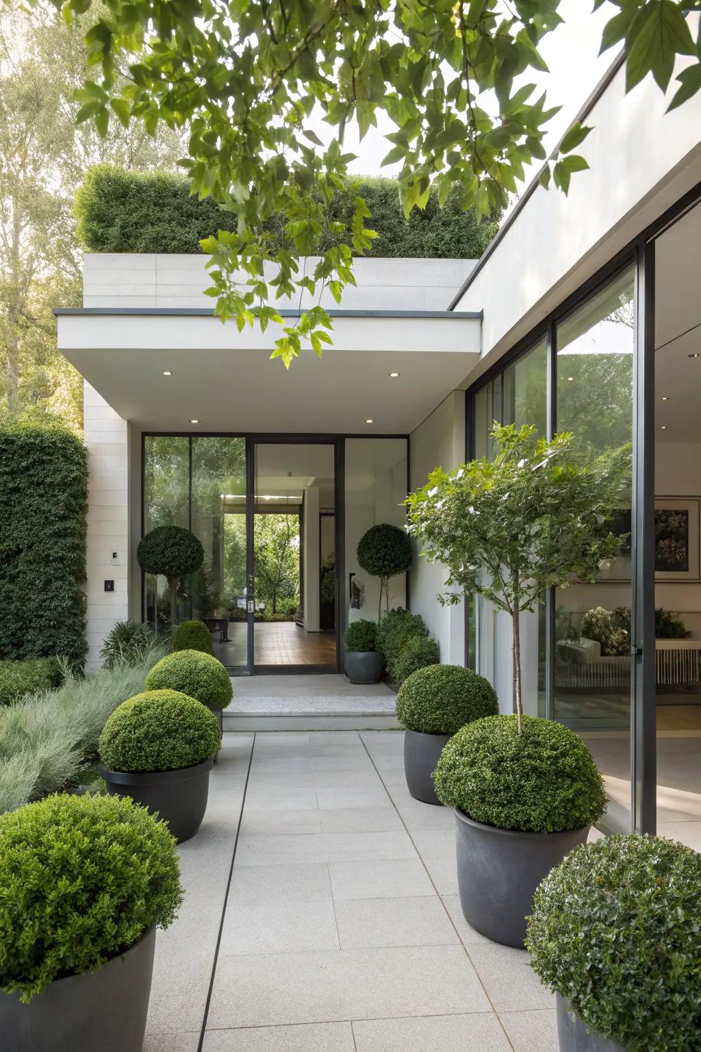 Landscaped entrance with lush greenery.