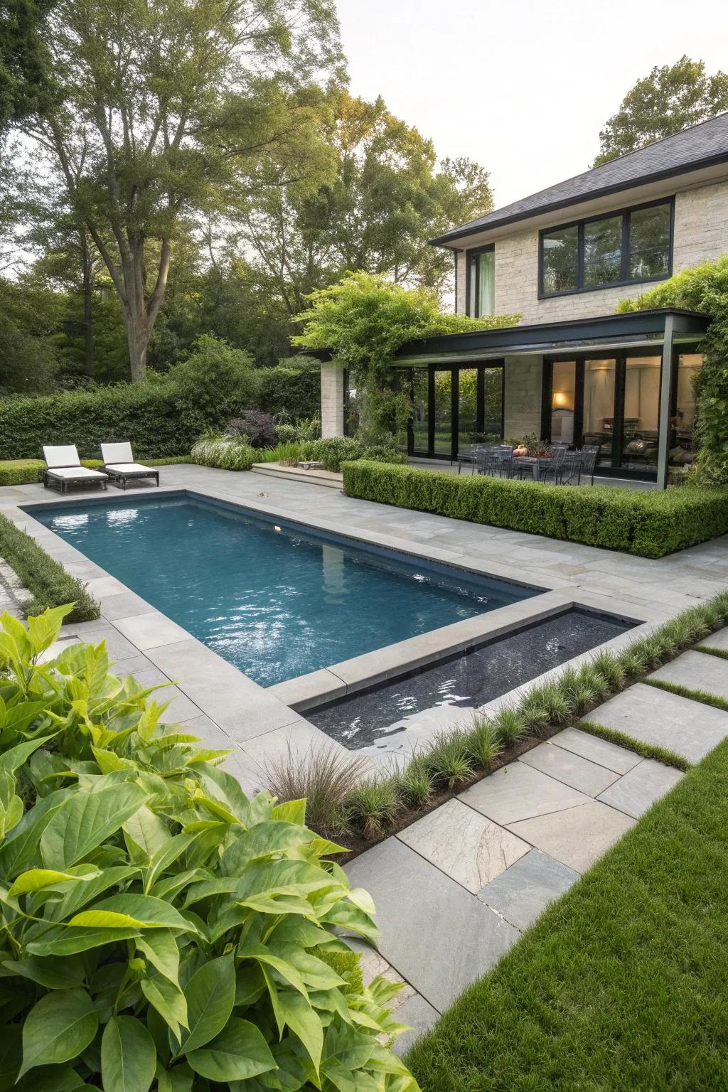 A pool area beautifully integrated with premium materials and greenery.