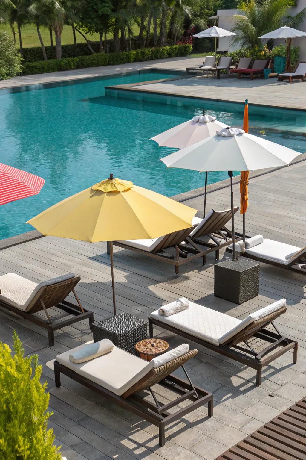 Create a luxurious poolside atmosphere with stylish furniture.