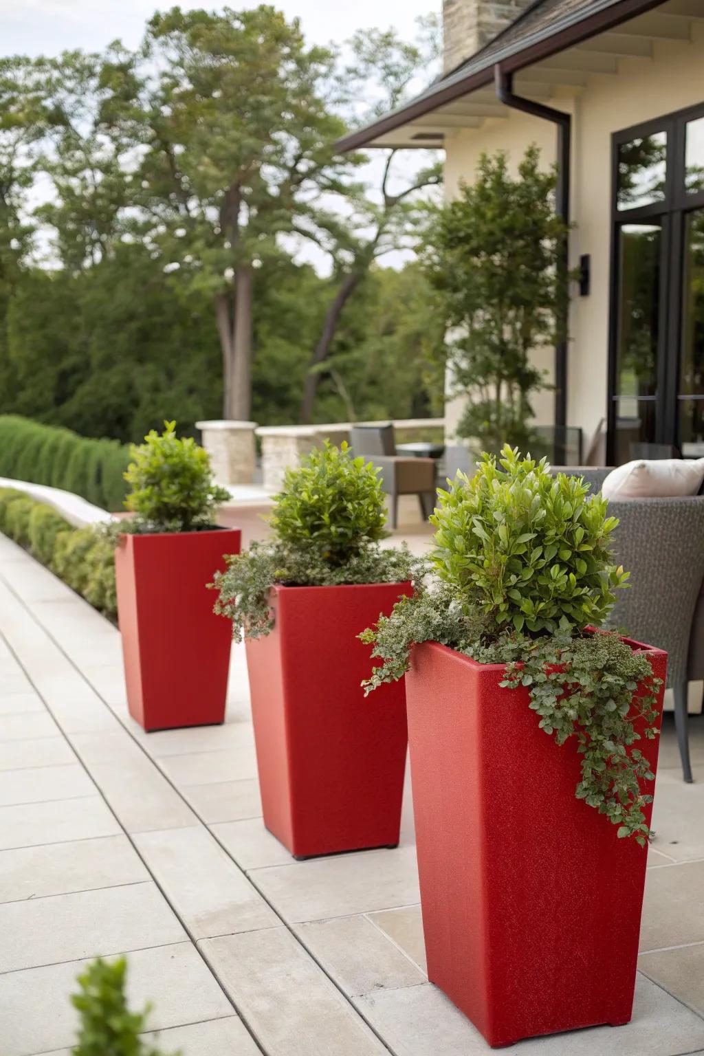 Elevate your garden design with elegant red planters.