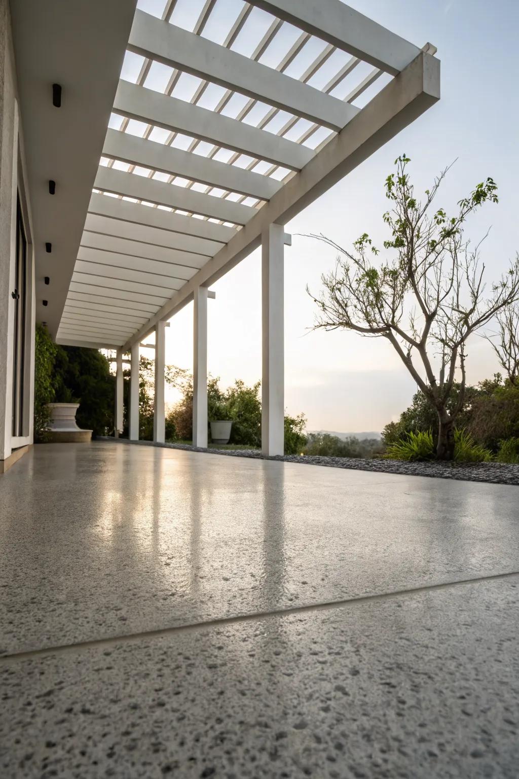 Concrete flooring offers a modern and customizable option for pergolas.