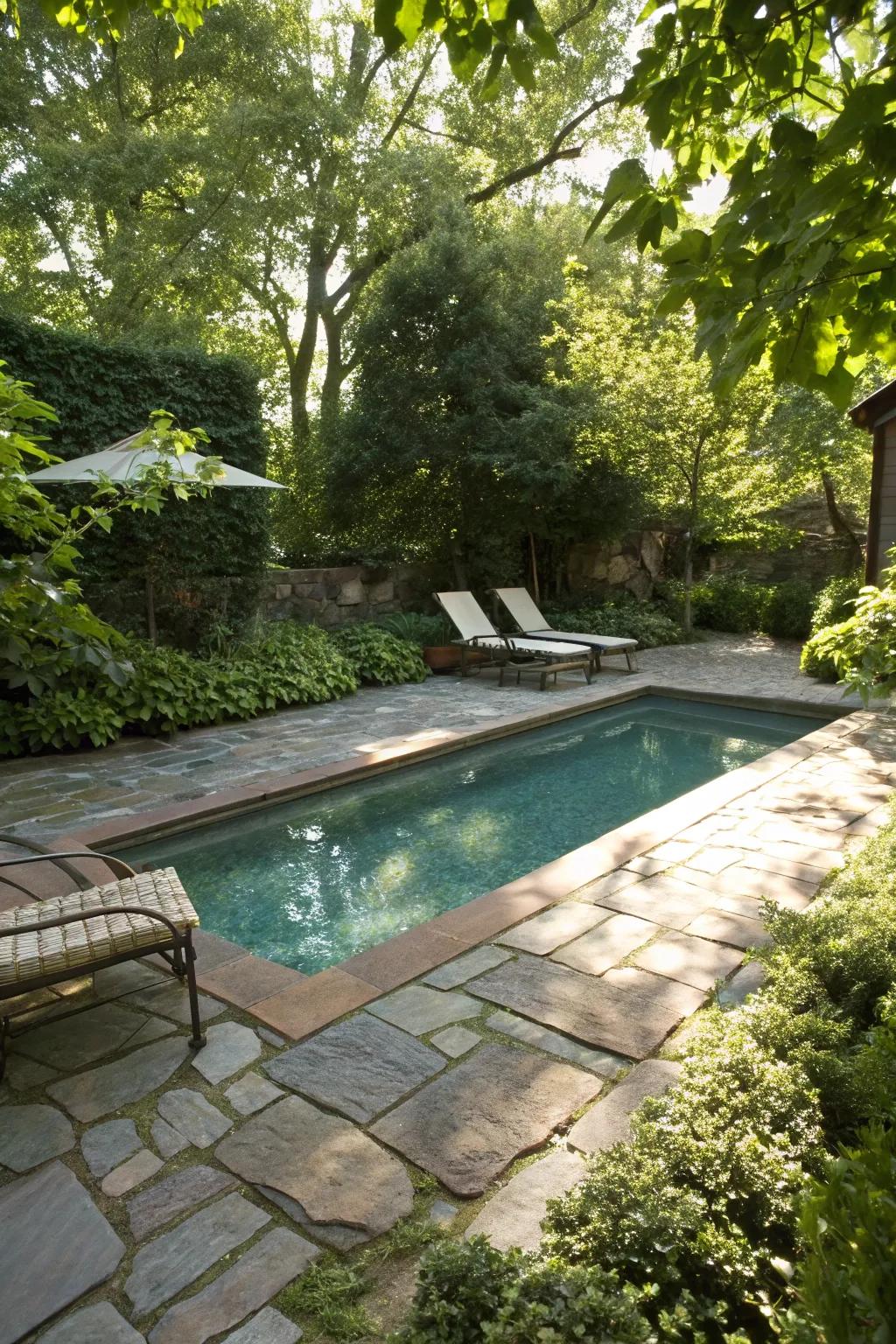 Natural stone paving adds texture and elegance to a small pool area.