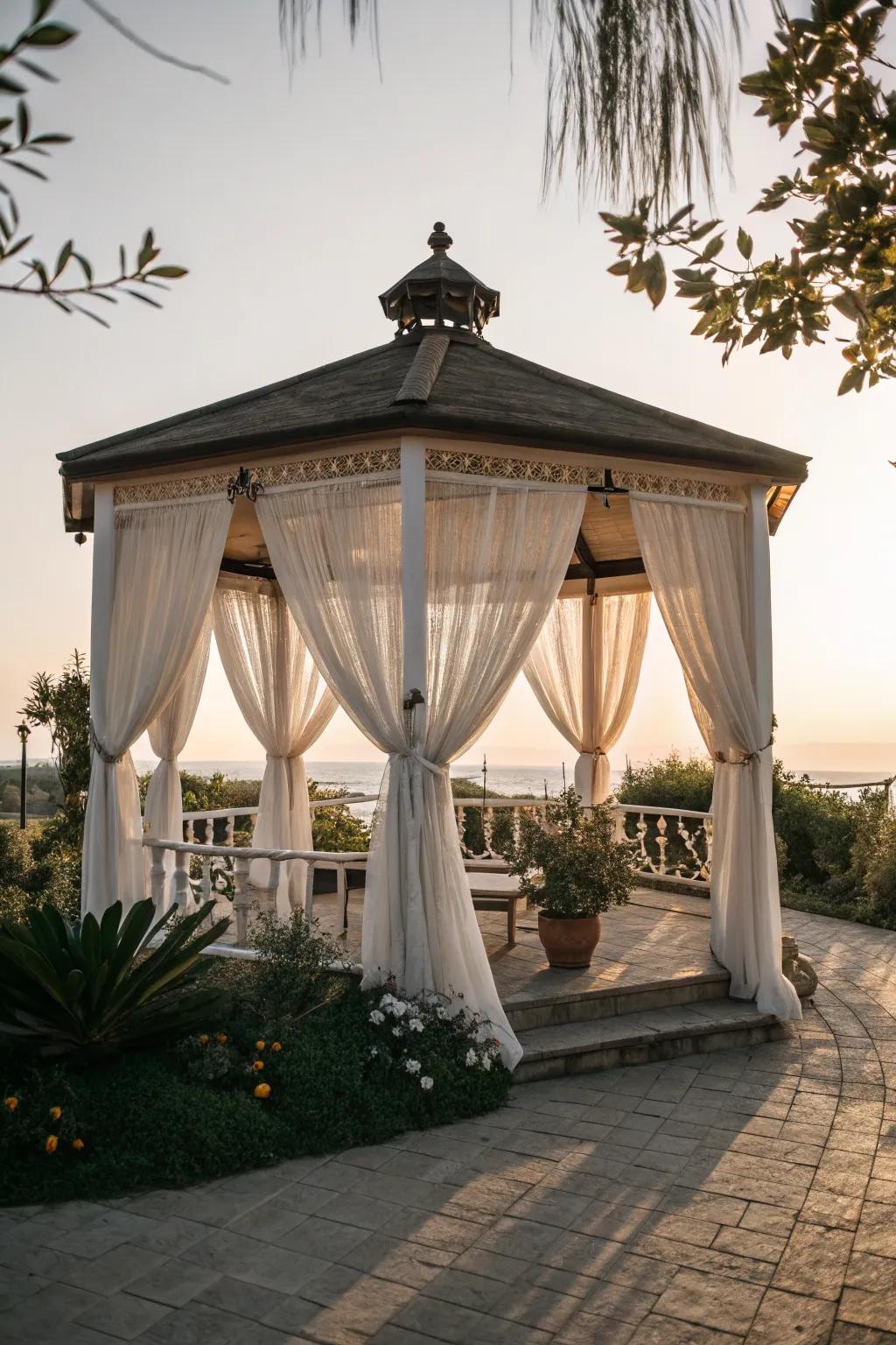 Curtains adding elegance to a small patio gazebo.