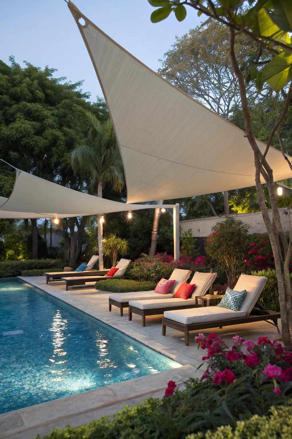 Stylish sail shades offering comfortable shade by a poolside.