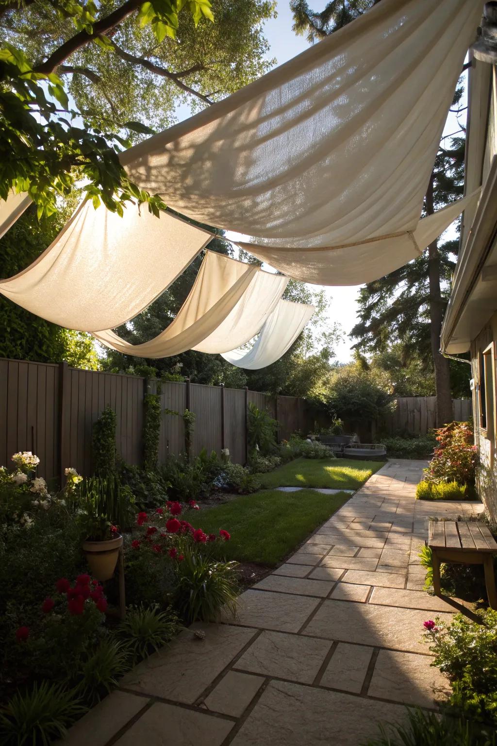 Fabric canopies offer a soft, dreamy touch to backyard shading.