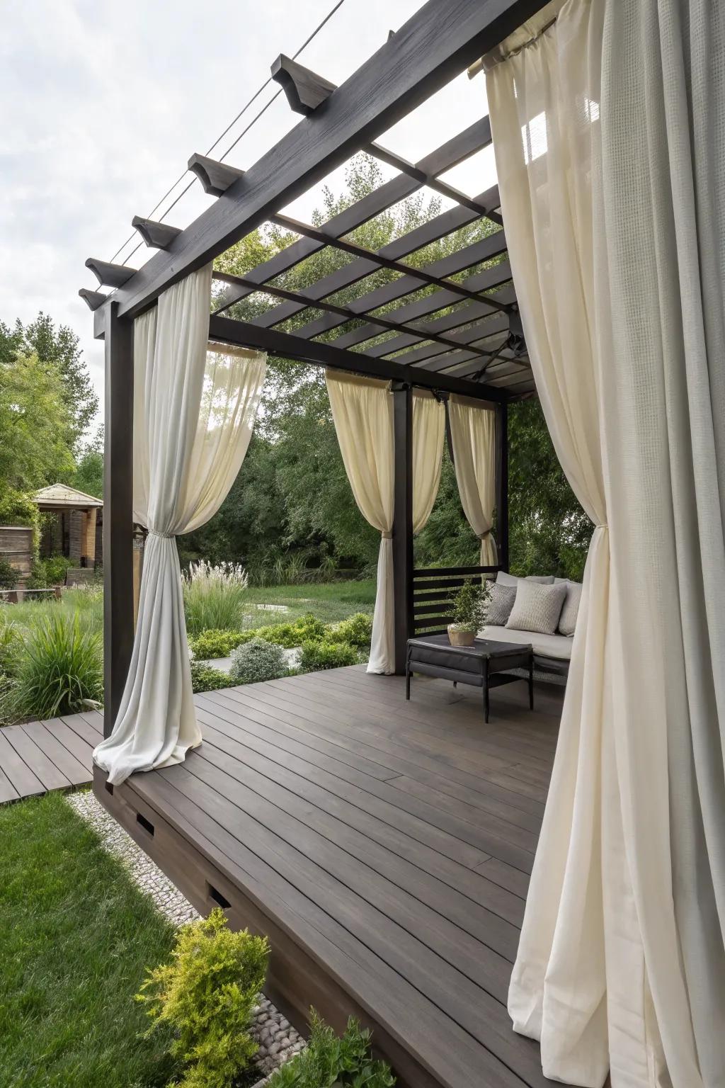 Stylish shade and privacy with outdoor curtains and a pergola.
