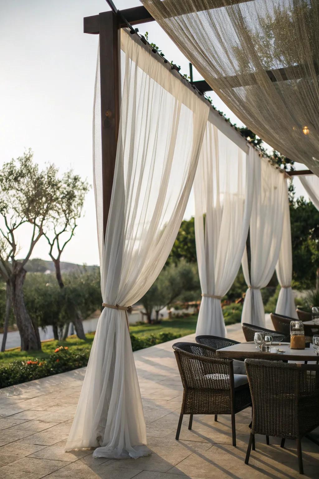 Sheer curtains add a touch of elegance to garden seating.