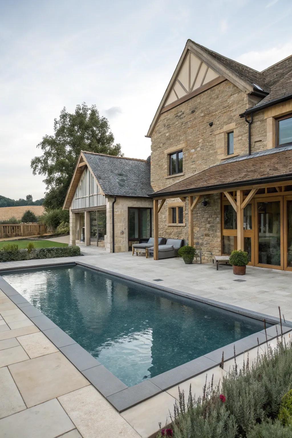 Modern and traditional elements create a harmonious farmhouse pool.