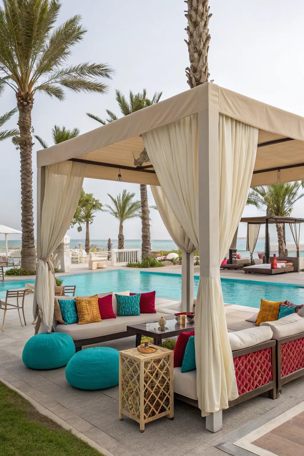 A luxurious lounge area under a canopy creates the perfect poolside retreat.