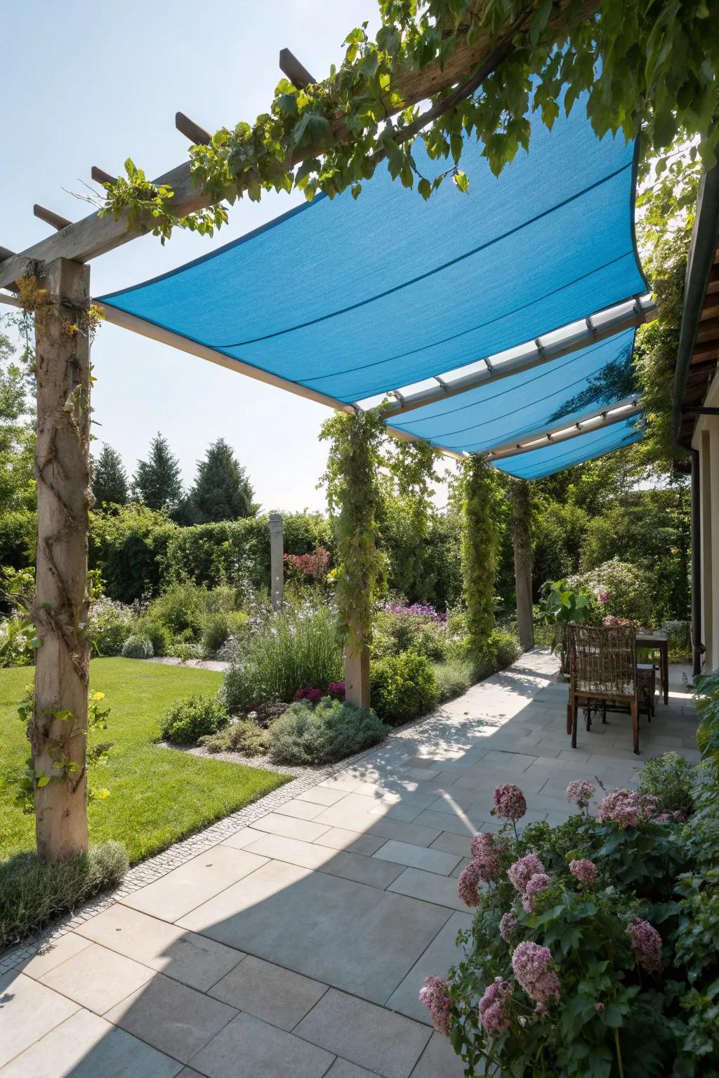 Stay cool and stylish with a shade sail over your pergola.