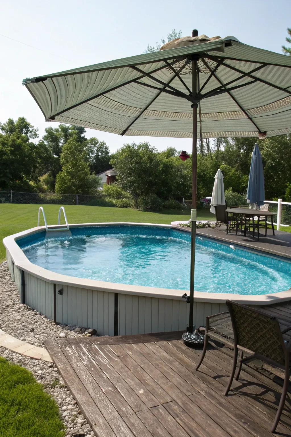 A shaded pool deck with a large umbrella for ultimate comfort.