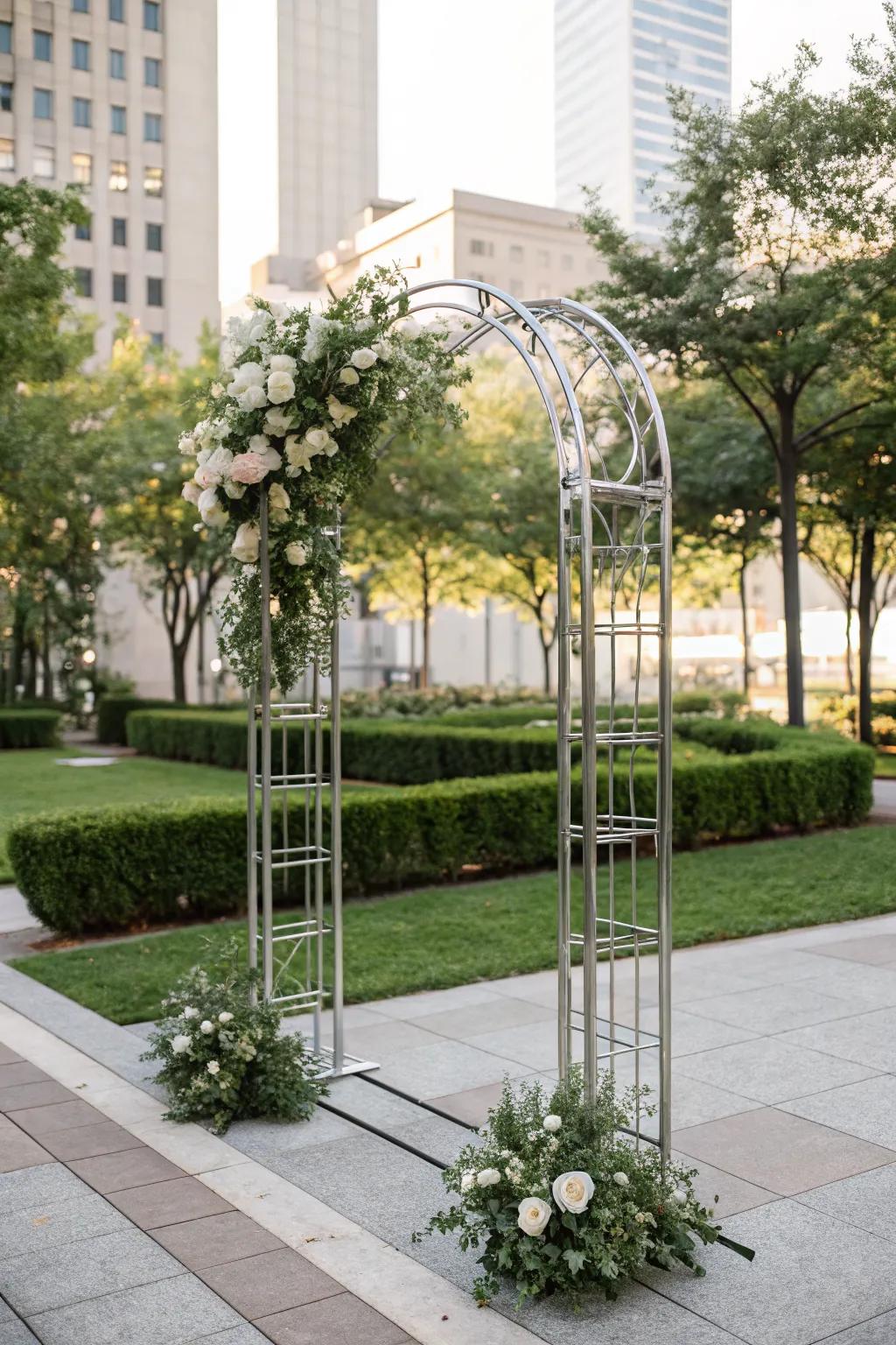 A modern metal arch with clean lines and elegant floral touches, perfect for a contemporary wedding.