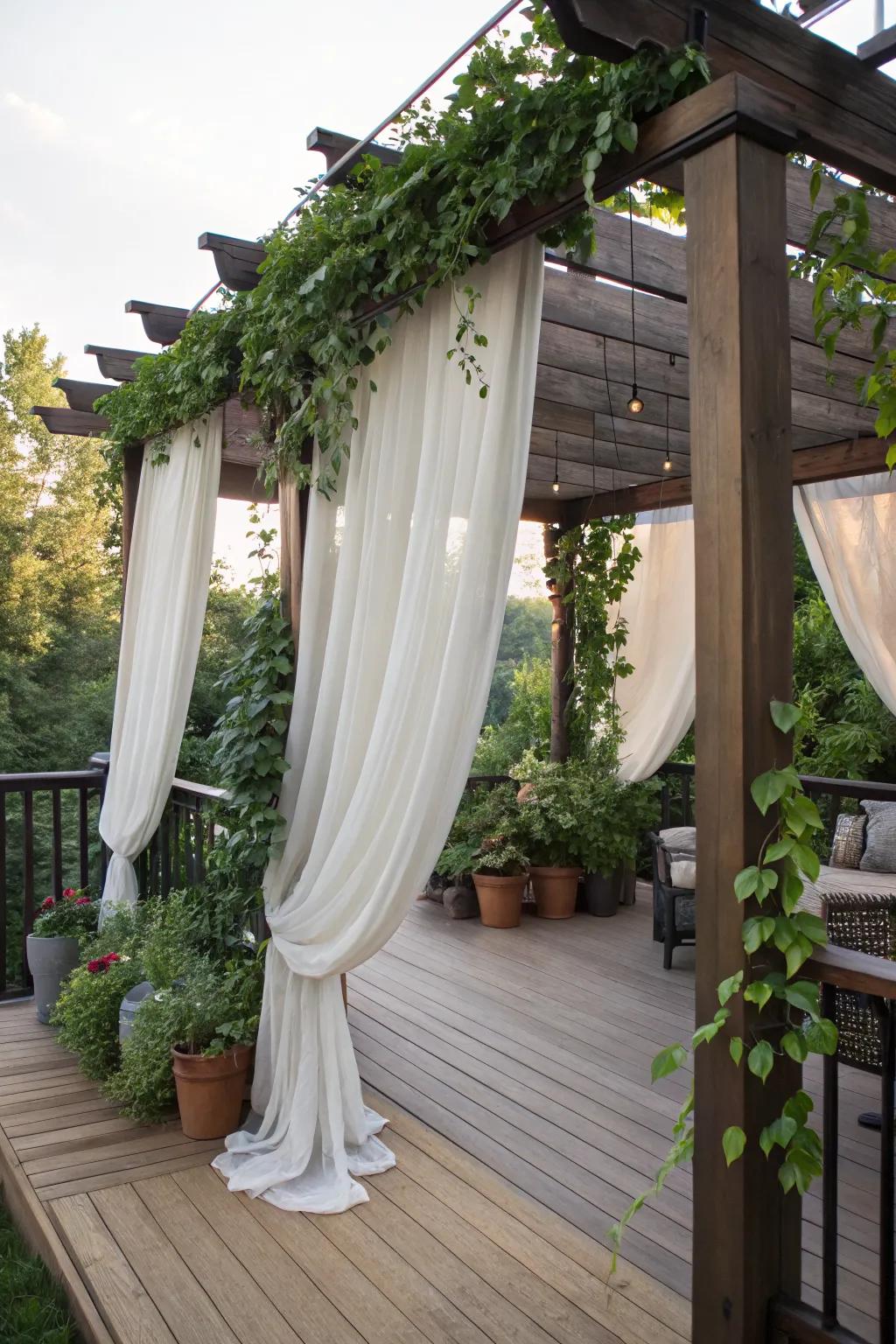 A pergola with drapes creates a cozy and private deck space.