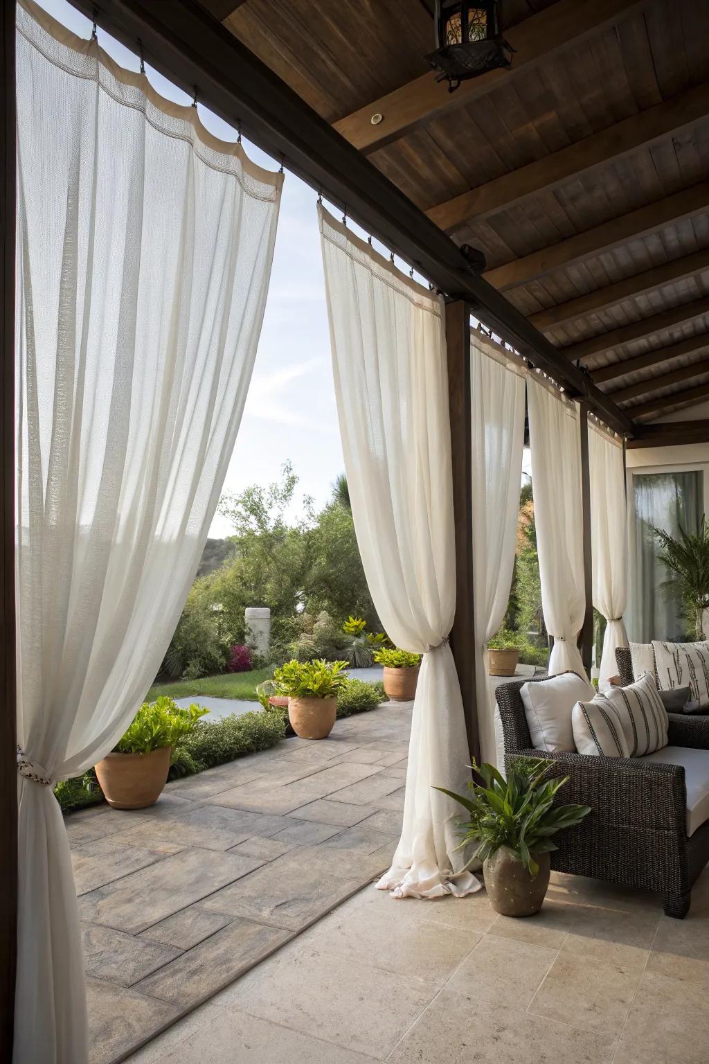 Outdoor curtains offer both shade and a touch of elegance.
