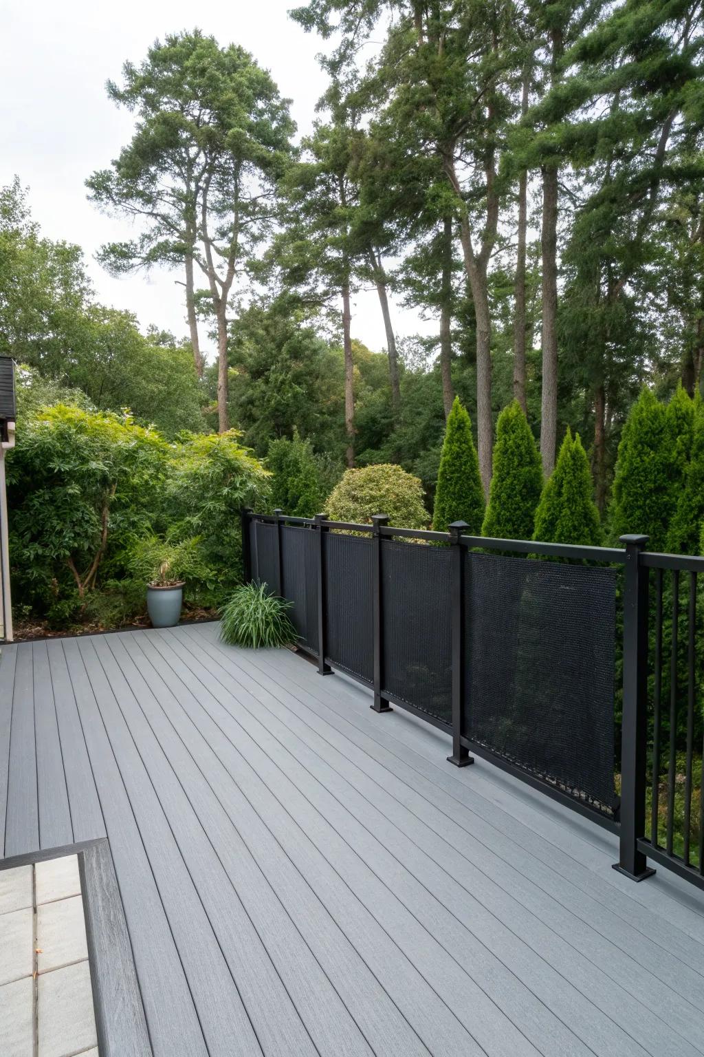 Stylish privacy screens on a grey deck, offering seclusion and style.