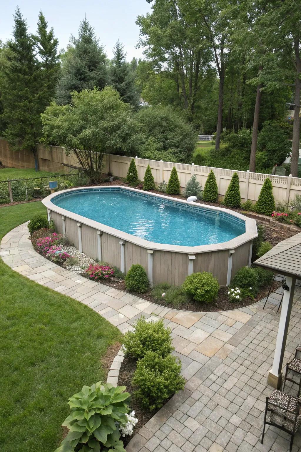 A custom-shaped above-ground pool adds a personalized touch to this landscaped backyard.