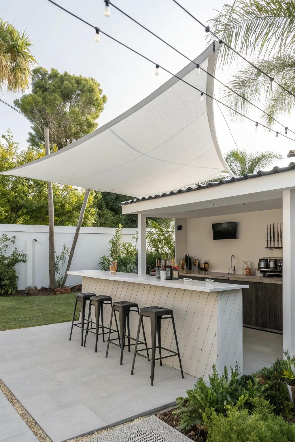 Sail shades provide a sleek and simple solution for outdoor bar coverage.