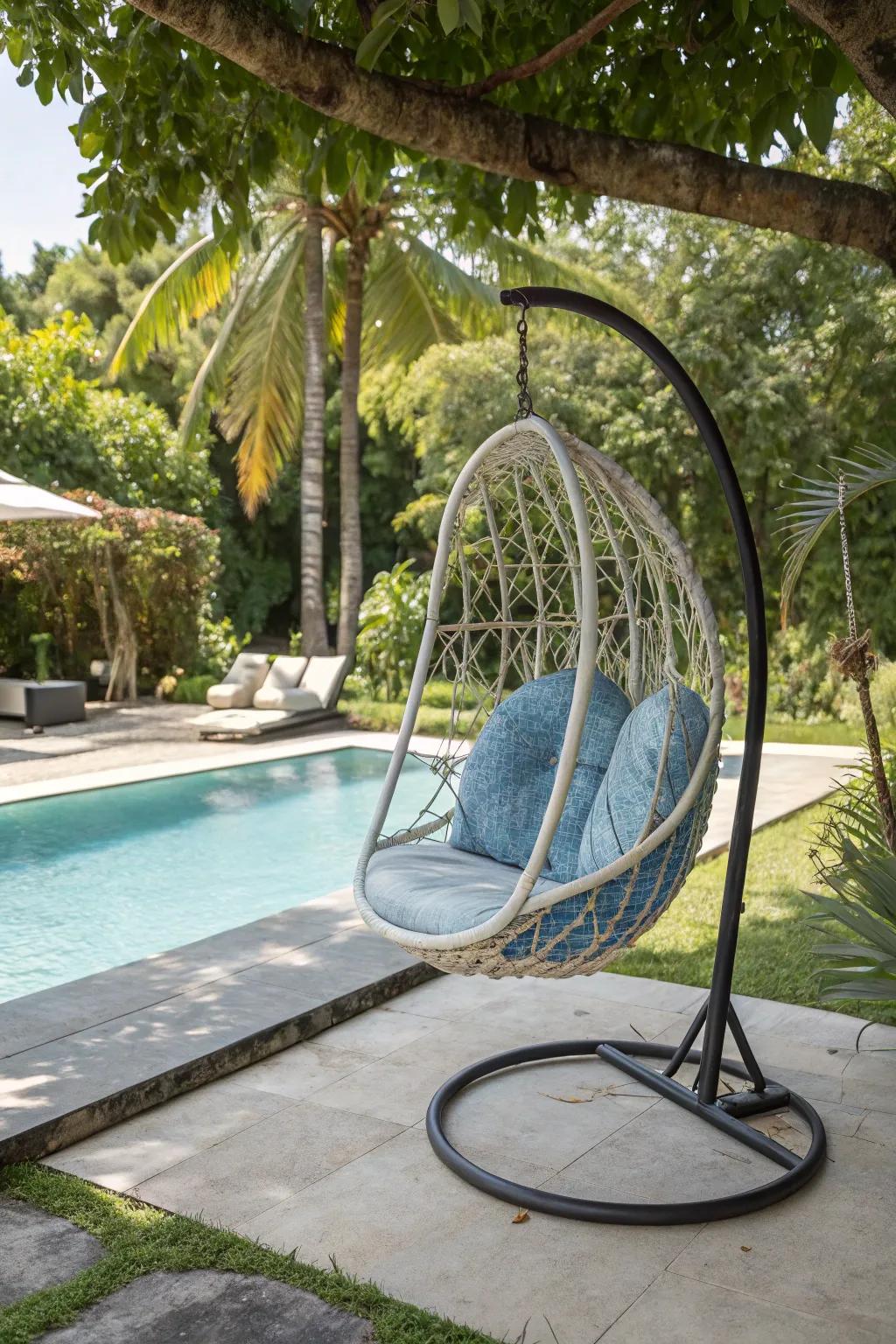 Unique swing chairs add a playful vibe to your poolside decor.
