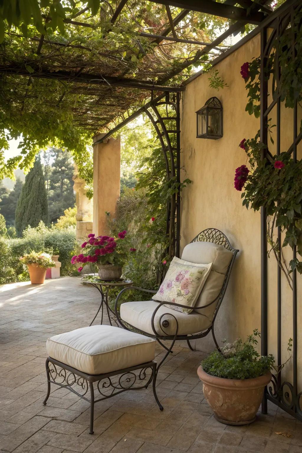 A cozy seating area with a wrought iron chair under a pergola.