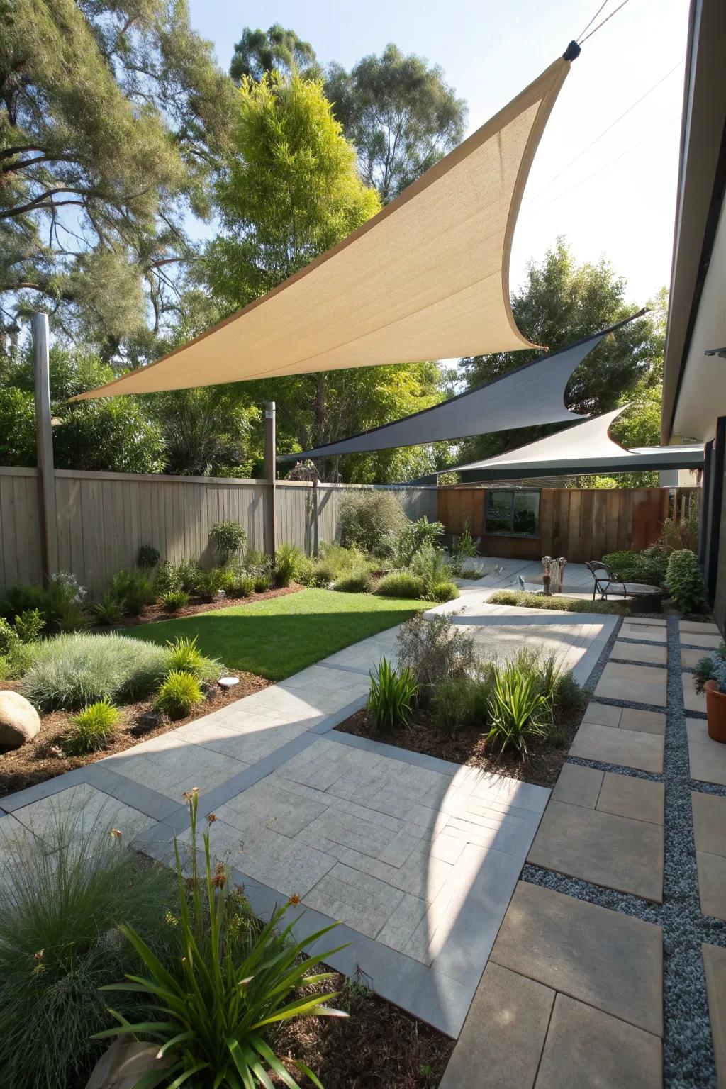 Geometric sail shades adding an artistic flair to a backyard.