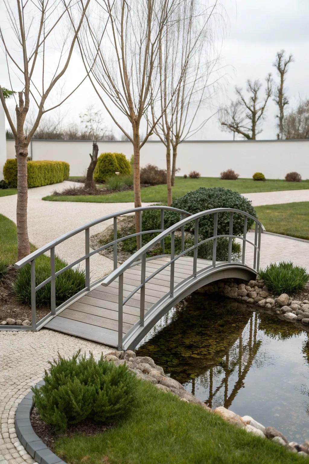 A modern metal bridge adds sleekness to a contemporary garden.