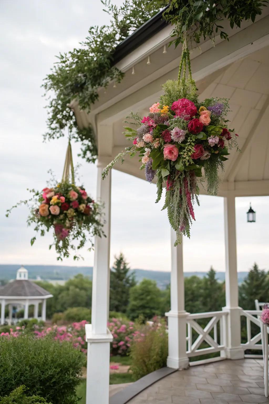 Whimsical floral corsages hanging gracefully inside a gazebo.