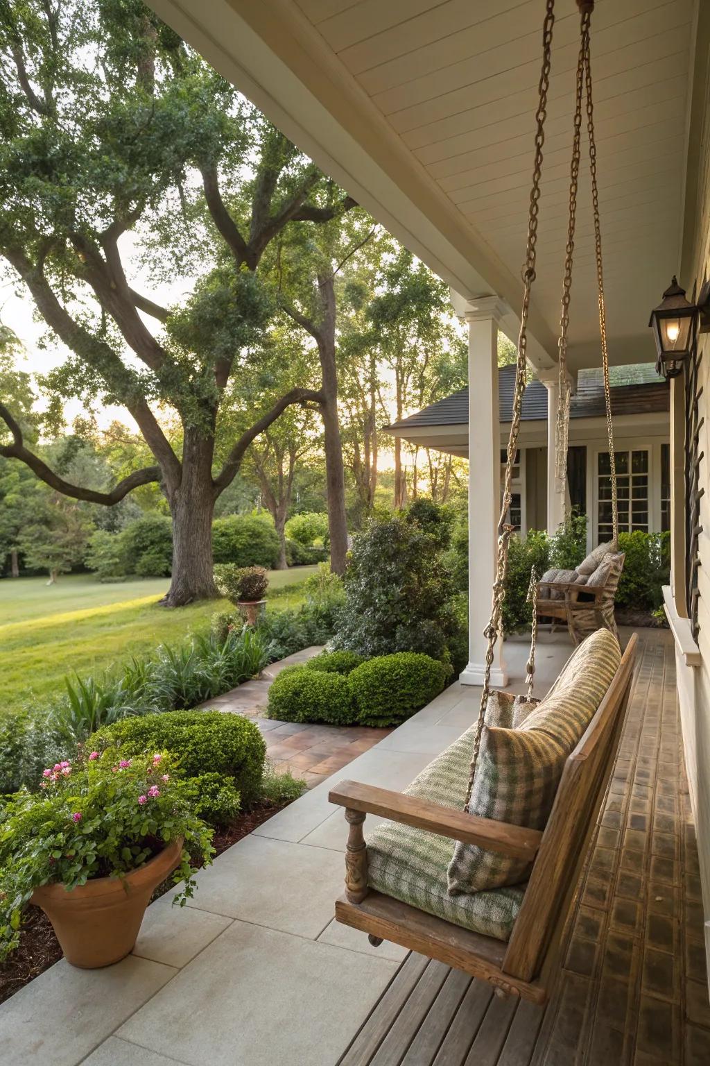 Lush landscaping enhances the coziness of an open front porch.