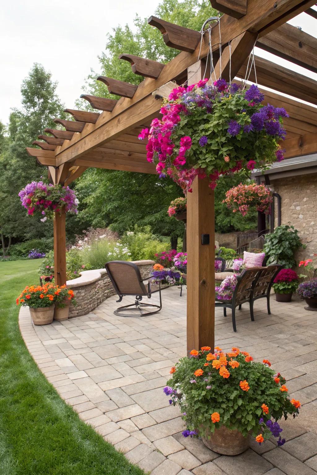Hanging planters add vibrant life to a pergola setting.