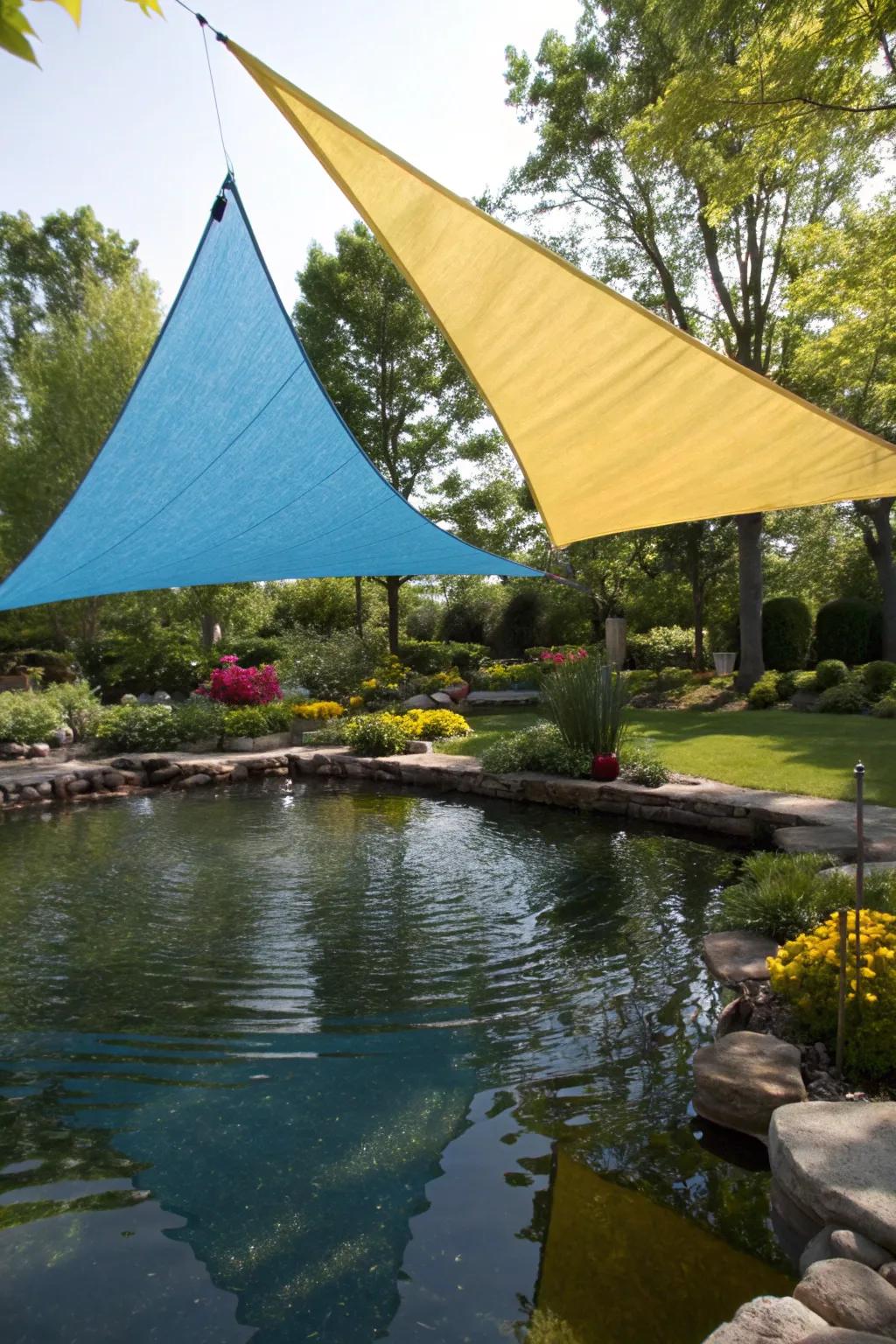 Modern shade sails offering stylish pond protection.