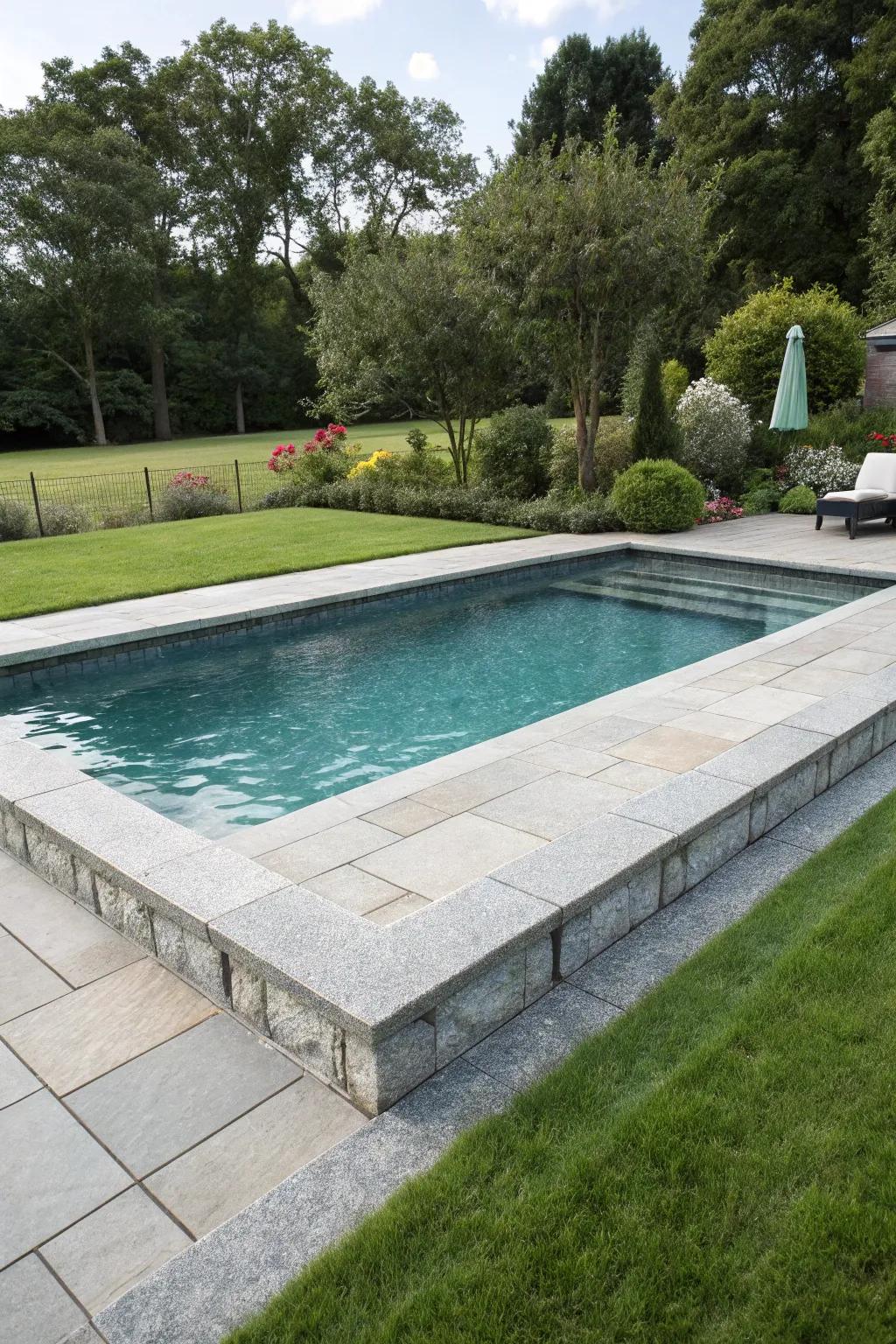 Granite tiles offer a durable and timeless poolside solution.