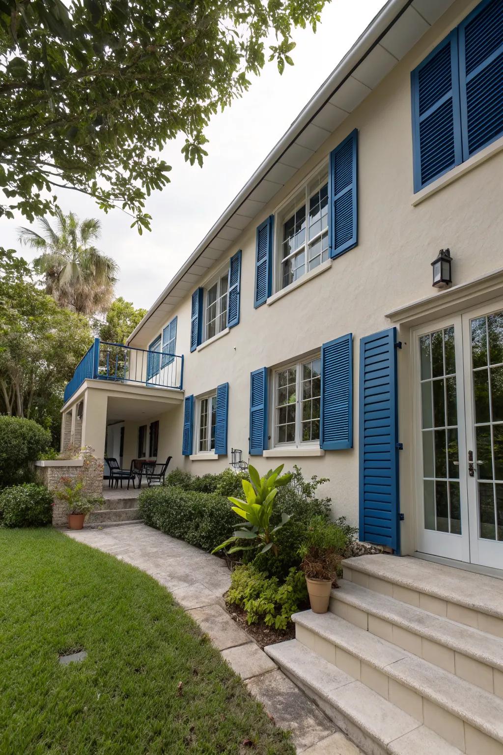 Accent shutters in deep blue add depth to this charming split-level home.