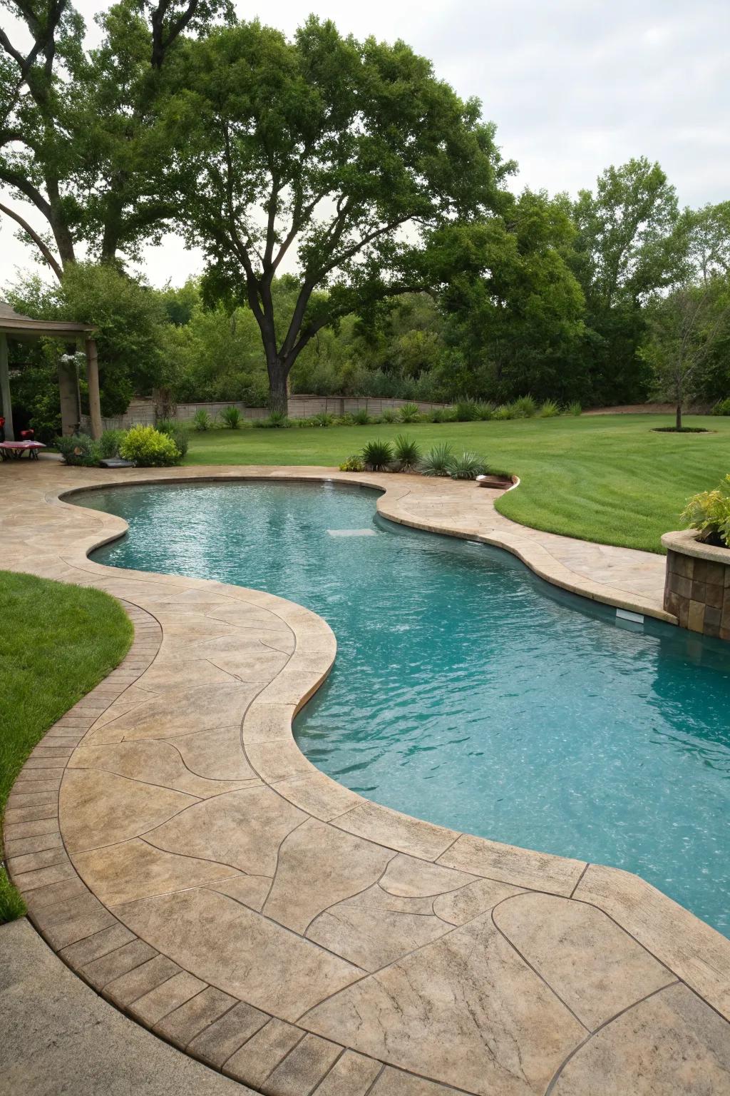 Creative pool shape enhanced by custom stamped concrete.