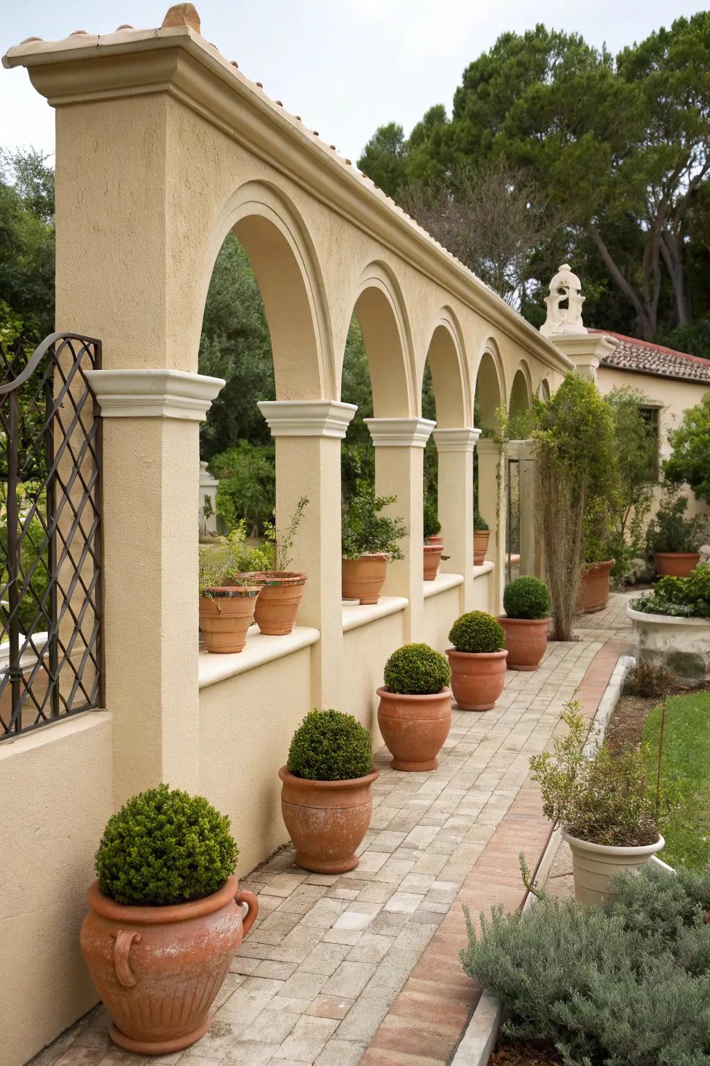 Elegant stucco fence featuring graceful arches.