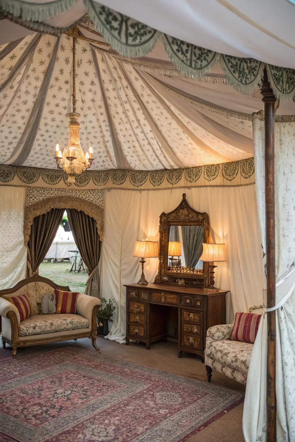 A vintage glamour tent featuring antique furniture and elegant drapery.