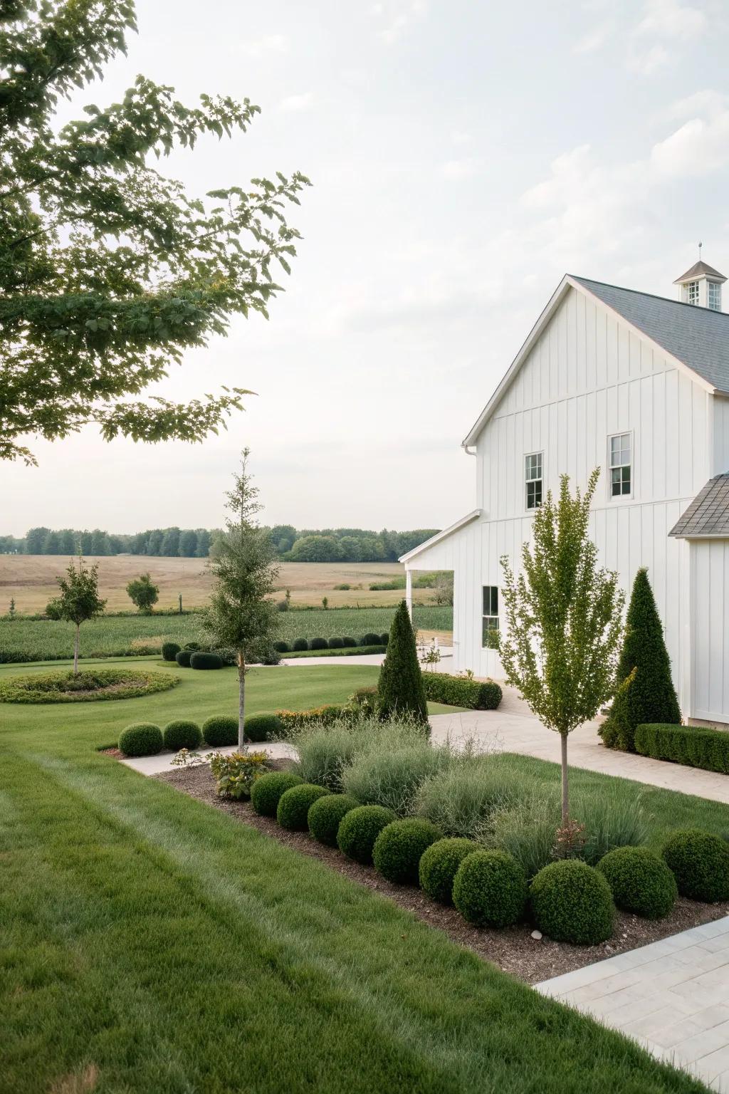 Simple elegance with minimalistic landscaping around a white farmhouse.