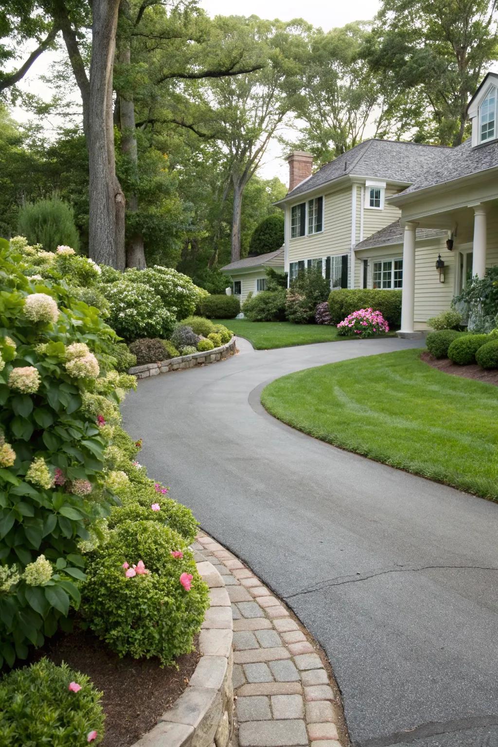 Curved driveways add elegance and guide the eye.