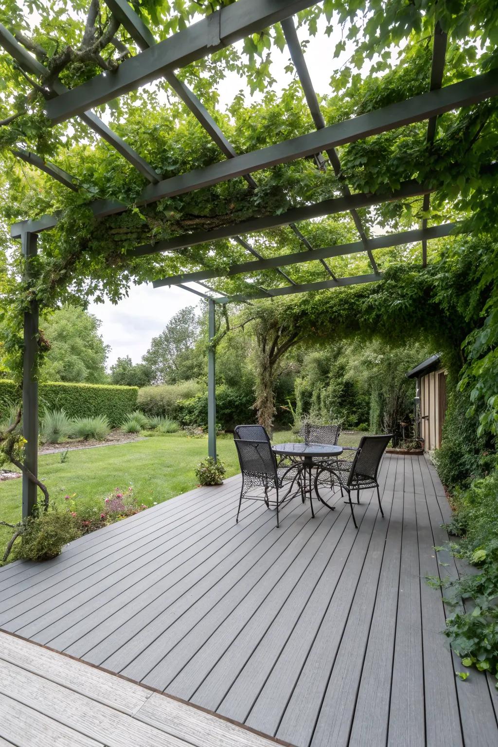 A pergola adds both shade and style to grey composite decking.
