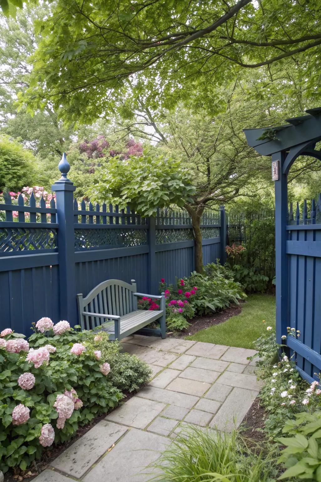 Midnight blue fences create a serene and tranquil garden escape.