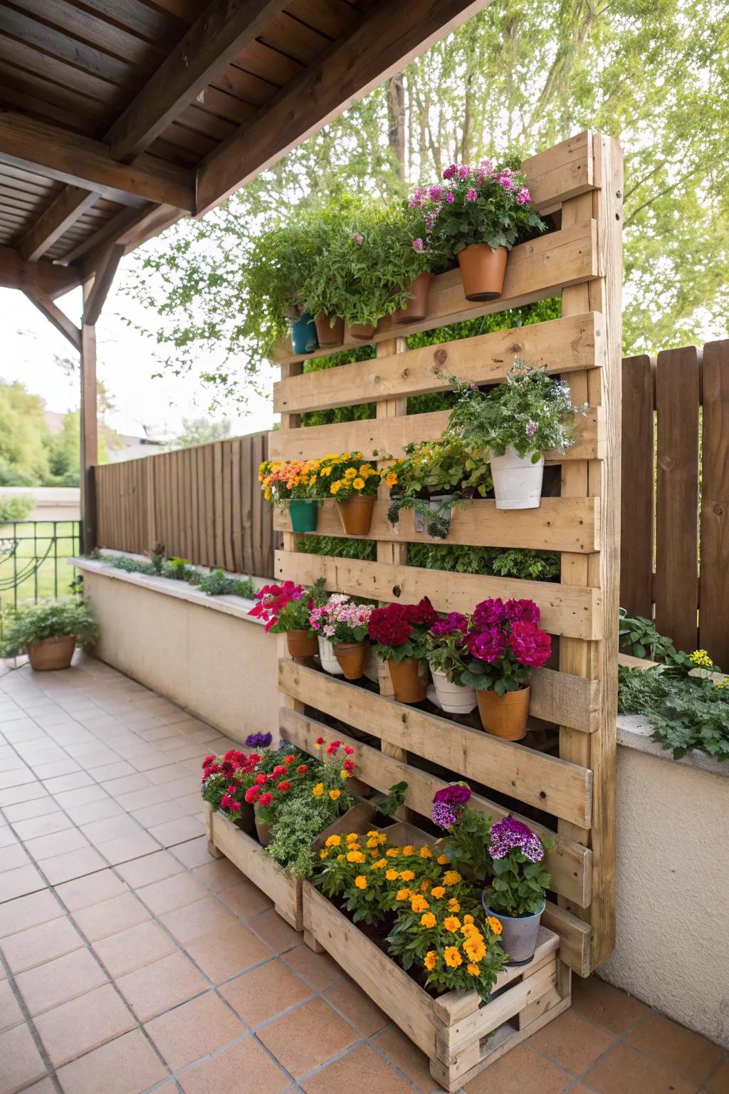A DIY flower wall made from a wooden pallet and potted flowers.