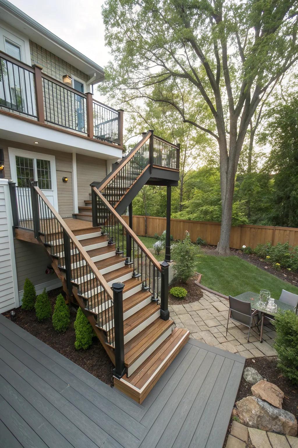A second-story deck featuring stairs with a mix of wood and stone materials.